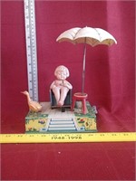 Wind up little girl on patio tin toy *duck and
