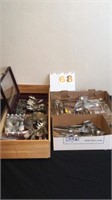 Lot of misc cutlery and salt pepper shakers.