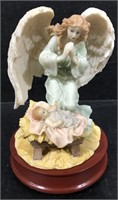 SERAPHIM ANGEL AND BABY MUSICAL FIGURINE ON WOODEN