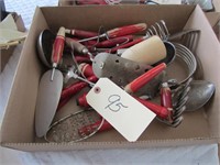Red wood handle kitchen utensil