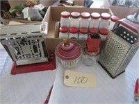 Red top grater, old toaster, spice jars