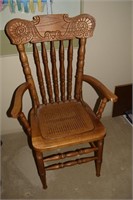 Antique pressback arm chair w/ cane seat