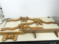 Assortment of Wooden Bows and a Shelf