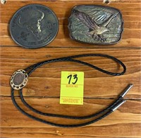 Two belt buckles and bolo tie