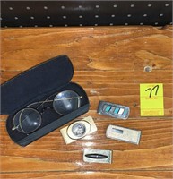 Antique eyeglasses and money clips