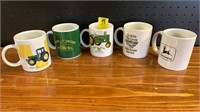 Five John Deere coffee mugs