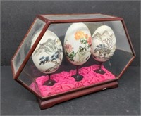 Chinese hand-painted eggs in display case