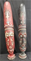 Pair of carved hand painted wooden tribal masks