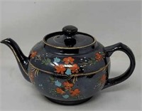 Hand painted teapot, marked at the bottom