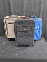 Group of 3 rolling suitcases