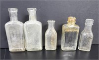 5 bouteilles de vintage en verre