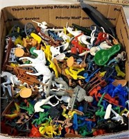 Box of plastic farm toys and cowboys and Indians