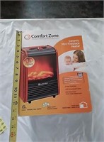 Ceramic mini fireplace heater. New in. Box never