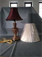 Gold tone lamps with red shade 
Lamp is 18" tall