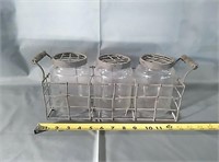 Metal rack with glass containers 
Lids are also
