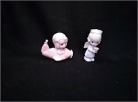 Precious moments figurines 
"Heaven Bound" and