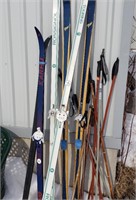 lot of skiis and poles