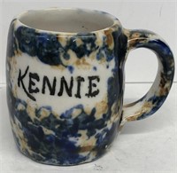 Brown and blue sponge where mug Kennie
