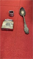 Sterling silver spoon, old turkey tag, matchbox