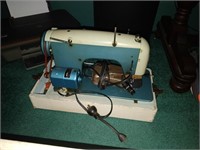 white sewing machine in case