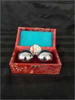 Chinese metal Baoding balls in case.