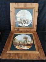 Two wooden framed seasonal prints.