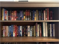 2 Shelves of Paperback Books- fiction