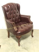 Leather look burgundy wing back chair