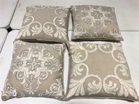 Group of four feather filled throw pillows