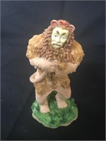 The wizard of Oz the cowardly lion figurine .