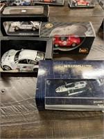 4 Collectible Diecast Cars in Cases