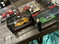 4 Collectible Diecast Cars in Cases