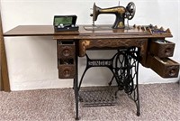 Singer Treadle sewing machine with the accessory’s