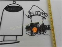 Three metal Welcome signs