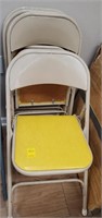 4 yellow folding chairs