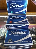 A dozen Titleist Tour Soft golf balls.