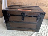 Antique trunk with tacked cloth lining. 24”H x
