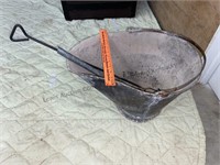Old galvanized ash bucket with shovel and rake