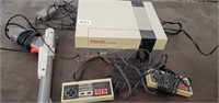 Nintendo w/ 2 remotes, one zapper, 7 games