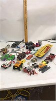 Lot of die-cast and plastic trucks, cars,