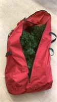 Christmas tree in red bag with lights