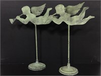 Green metal cherub candlestick pair