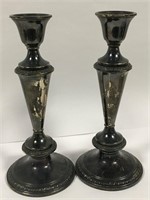 Pair Of Brown Sterling Weighted Candle Sticks