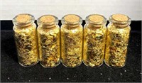 Five bottles of gold flakes