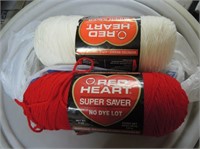 LARGE ROLLS OF RED AND WHITE YARNS