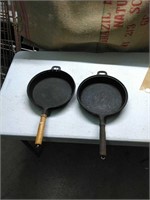 Two nine inch cast iron wood handled pans