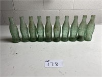 (10) Green Coca-Cola Glass Bottles with Location
