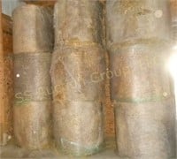 Nine large round wheat straw bales