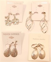 Set of Four New Pairs Of Silver Clip-On Earrings.