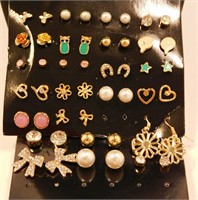 25 New Pairs Of Gold Tone Stud Style Earrings.
